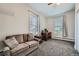 Bedroom featuring a desk, windows, and a sofa at 3127 W 28Th Ave # 2, Denver, CO 80211