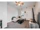 Neutral-toned living room featuring a sectional sofa, dark wood coffee table, and a modern entertainment center at 3127 W 28Th Ave # 2, Denver, CO 80211