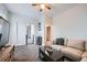 Inviting living room with a comfortable sofa, dark-stained coffee table, and neutral color palette at 3127 W 28Th Ave # 2, Denver, CO 80211