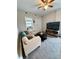 Bright living room with a sectional sofa, dark wood coffee table, and neutral walls at 3127 W 28Th Ave # 2, Denver, CO 80211