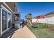 Enjoy the spacious fenced-in backyard featuring a playground and artificial turf, perfect for Gathering fun and relaxation at 5534 Killarney St, Denver, CO 80249