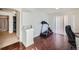 Bonus room with dark laminate floors, and a fitness area at 5534 Killarney St, Denver, CO 80249
