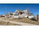 Charming two-story home with a two-car garage and quaint front porch and sidewalk at 5534 Killarney St, Denver, CO 80249