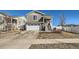 Two-story home features an attached two-car garage and landscaped front yard at 5534 Killarney St, Denver, CO 80249