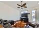 Bright living room features a ceiling fan, recessed lighting, and wood floors at 5534 Killarney St, Denver, CO 80249