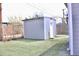 Backyard featuring a shed and an artificial lawn for low maintenance at 4460 Columbine St, Denver, CO 80216