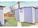 A backyard featuring a shed on top of an artifical lawn for low maintenace at 4460 Columbine St, Denver, CO 80216