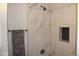Updated bathroom with tiled shower featuring built-in niche, new hardware and clean lines at 4460 Columbine St, Denver, CO 80216