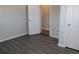 Clean bedroom with new flooring, neutral walls, and updated lighting fixture and doors at 4460 Columbine St, Denver, CO 80216