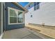 Backyard view, featuring a concrete patio and gravel at 920 Promenade Dr, Superior, CO 80027