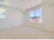 Spacious bedroom with large windows and neutral carpeting at 920 Promenade Dr, Superior, CO 80027