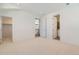 Bright bedroom with three entry doors that lead to a walk-in closet, hallway, and bathroom at 920 Promenade Dr, Superior, CO 80027