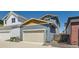 View of the two car garage, which is attached to the house at 920 Promenade Dr, Superior, CO 80027