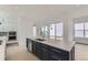 Modern kitchen featuring a spacious island with seating and stainless steel appliances at 920 Promenade Dr, Superior, CO 80027