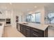 Bright kitchen features a large island with seating, stainless steel appliances, and ample counter space at 920 Promenade Dr, Superior, CO 80027