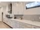 Bright kitchen featuring white cabinetry, light countertops, and stainless steel appliances at 920 Promenade Dr, Superior, CO 80027