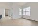 Bright living room with light wood floors, sliding glass doors, and large windows at 920 Promenade Dr, Superior, CO 80027