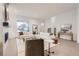 Bright living room features a large, comfortable white couch, modern fireplace, and hardwood floors at 920 Promenade Dr, Superior, CO 80027