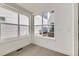 Bright living room with hardwood floors and large windows overlooking the outdoors at 920 Promenade Dr, Superior, CO 80027