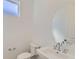 Well-lit powder room featuring a decorative mirror and sink at 920 Promenade Dr, Superior, CO 80027