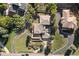 The aerial view showcases the property's landscaping and roof architecture at 11039 Roxborough Dr, Littleton, CO 80125