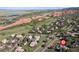 Beautiful aerial view of the residential area near golf course and striking red rock formations in Morrison, Colorado at 11039 Roxborough Dr, Littleton, CO 80125