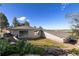 The backyard has well-maintained landscaping with a mix of greenery at 11039 Roxborough Dr, Littleton, CO 80125