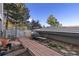 The backyard is adorned with a brick path and a bench in the garden at 11039 Roxborough Dr, Littleton, CO 80125