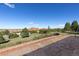 Backyard view of beautiful foliage, rock formations, and neighboring homes at 11039 Roxborough Dr, Littleton, CO 80125