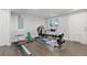 Home gym in basement featuring workout equipment and natural light at 11039 Roxborough Dr, Littleton, CO 80125