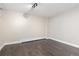 This bedroom boasts hardwood floors, neutral colored walls, and a heater along the floor at 11039 Roxborough Dr, Littleton, CO 80125