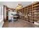 Dedicated home office with built in bookcase and wood floors at 11039 Roxborough Dr, Littleton, CO 80125