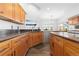 Bright kitchen with wood cabinets, stainless steel appliances and natural light at 11039 Roxborough Dr, Littleton, CO 80125