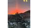 Beautiful landscape view featuring the rocky mountains and snow-covered evergreen trees during sunset at 11039 Roxborough Dr, Littleton, CO 80125