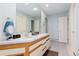 Bright and airy main bathroom featuring dual sinks and ample counter space at 11039 Roxborough Dr, Littleton, CO 80125
