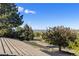 Scenic neighborhood view with trees and rock formations in the distance at 11039 Roxborough Dr, Littleton, CO 80125