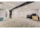 Large basement with carpet flooring, neutral walls, and bright recessed lights at 3827 S Fraser St, Aurora, CO 80014