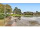 Outdoor basketball court featuring a well-maintained surface and mature trees in background at 3827 S Fraser St, Aurora, CO 80014