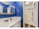 Bathroom features a marble top vanity, with a view of the bathtub and shower at 3827 S Fraser St, Aurora, CO 80014
