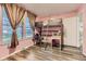 Playful bedroom with a loft bed, a desk, and lots of natural light at 3827 S Fraser St, Aurora, CO 80014