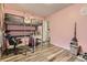 Lively bedroom with a loft bed, a desk, and space for storage at 3827 S Fraser St, Aurora, CO 80014