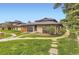 Property featuring lush green lawns and a tranquil setting at 3827 S Fraser St, Aurora, CO 80014