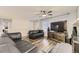 Cozy living room with modern design, a television, and hardwood floors at 3827 S Fraser St, Aurora, CO 80014