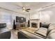 Inviting living room with modern decor, a fireplace, and a ceiling fan at 3827 S Fraser St, Aurora, CO 80014