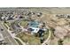 Aerial view of community pool, clubhouse, parking, green space, and walking paths at 13979 Night Owl Ln, Parker, CO 80134