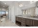 Primary bath featuring double vanity and shower with a tub visible at 13979 Night Owl Ln, Parker, CO 80134