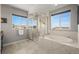 Bathroom featuring walk-in shower, tub and large window at 13979 Night Owl Ln, Parker, CO 80134