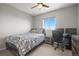 Bedroom with ceiling fan, window, bed, nightstand, computer, chair at 13979 Night Owl Ln, Parker, CO 80134