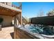 Inviting hot tub on the patio, with stairs leading to the deck and outdoor seating nearby at 13979 Night Owl Ln, Parker, CO 80134