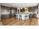 Well-appointed kitchen featuring stainless appliances, a large island and pendant lighting at 13979 Night Owl Ln, Parker, CO 80134